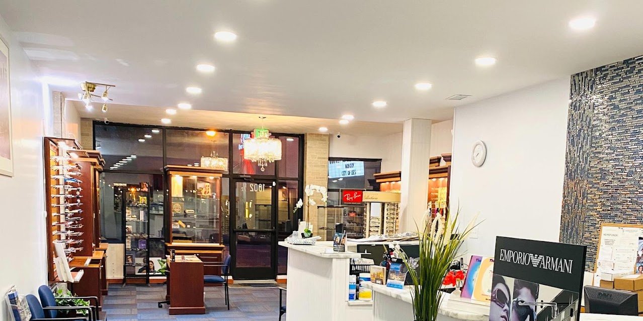 Inside the bright Aqua Vision Care optical boutique with designer frame displays.